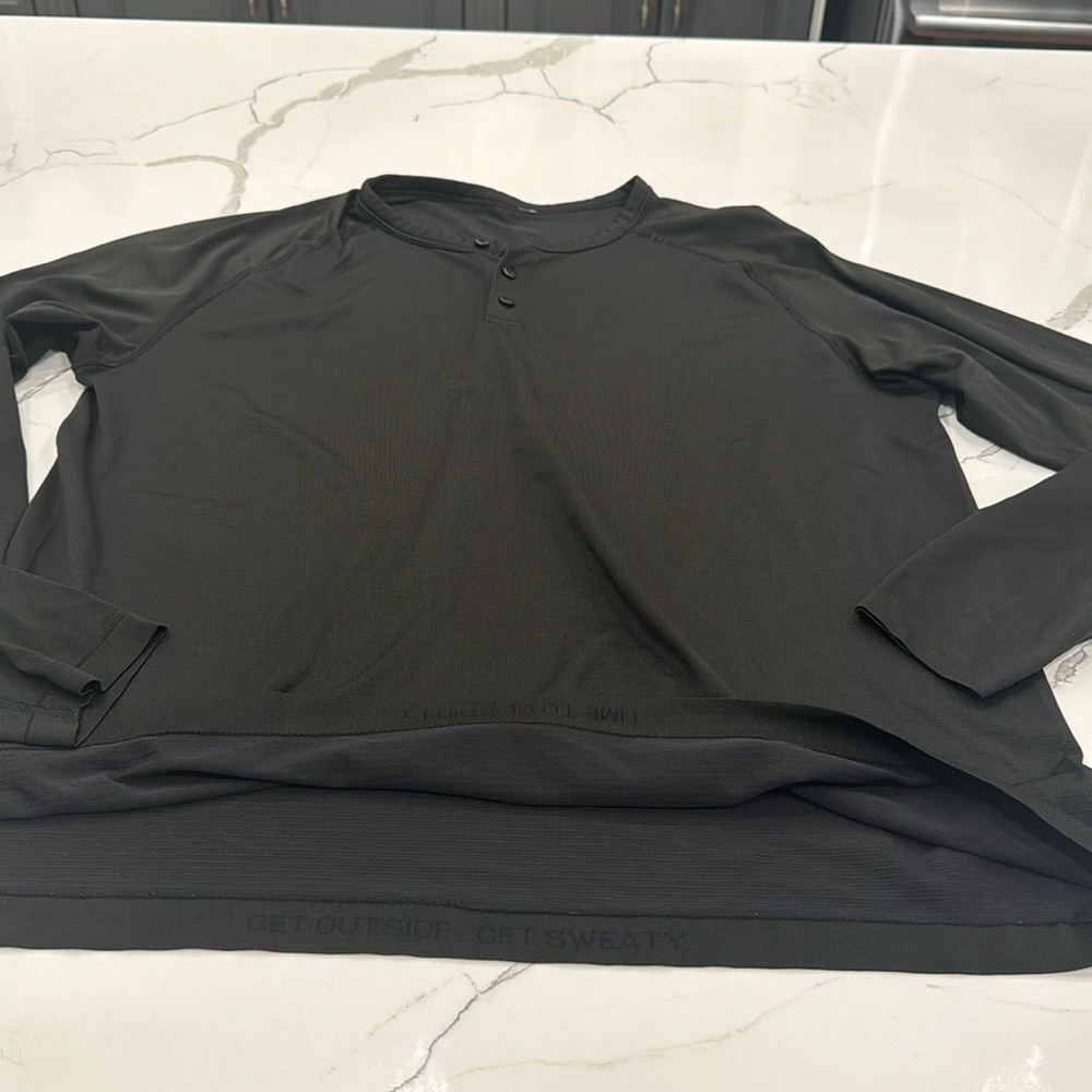 Lululemon. Men’s black, long sleeved, 3 button down shirt.  Great condition.